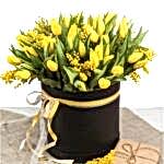 Bright spring bouquet of tulips and mimosa flowers. Mother's Day or Easter theme.